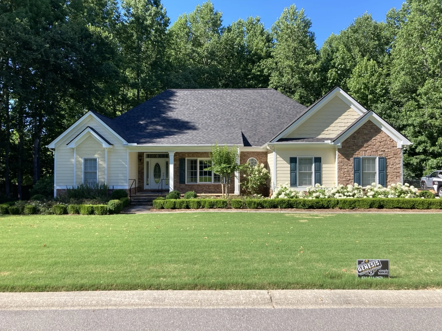 Completed roof replacement on a home photographed by Genesis Roofing & Repair